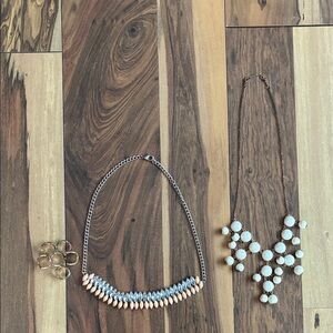 Two necklaces and set of six rings.